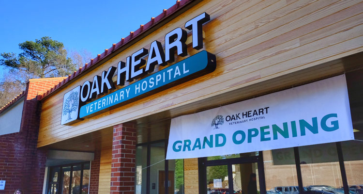 Oak Heart Veterinary Hospital exterior photo showing grand opening sign