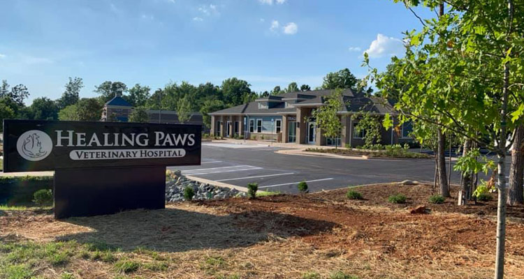Exterior photo of Healing Paws Veterinary Hospital showing building and sign